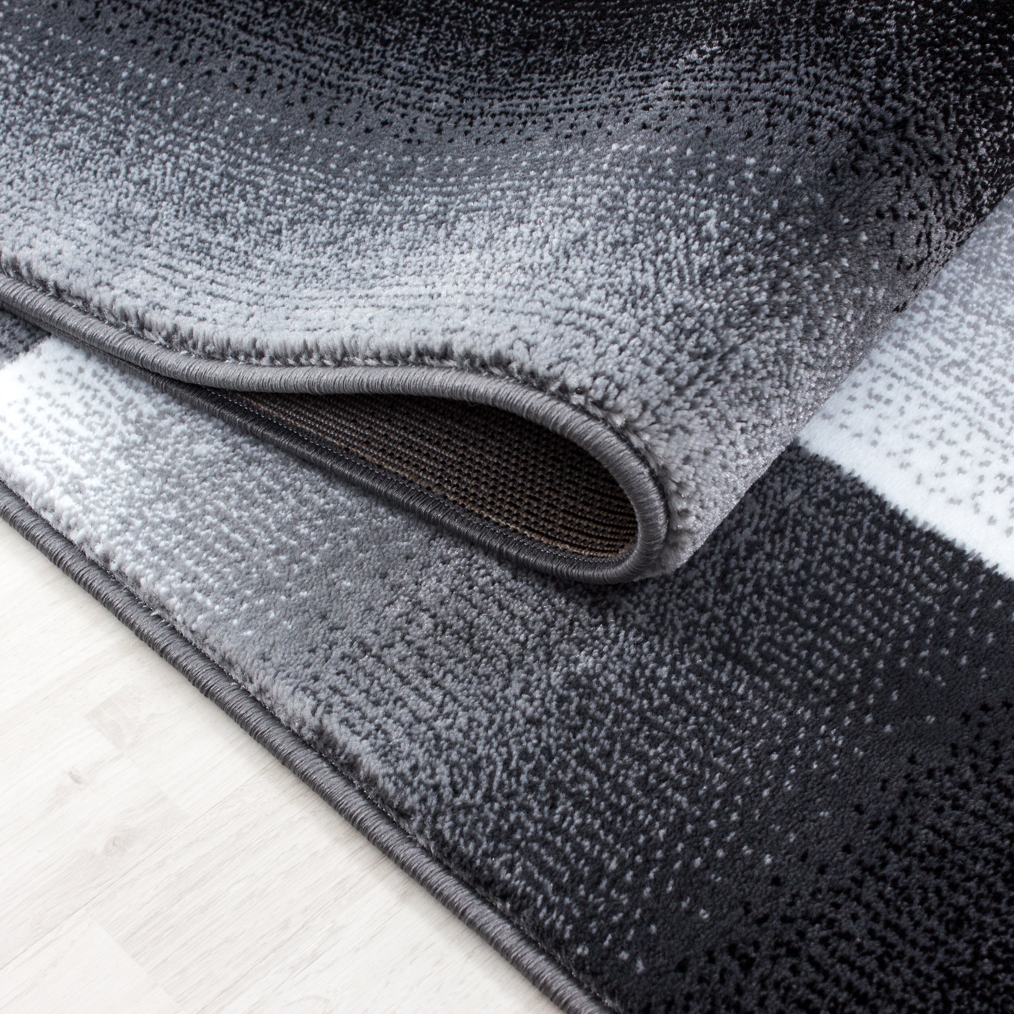 Modern short pile carpet for living room, abstract checkered design, black, easy to care for