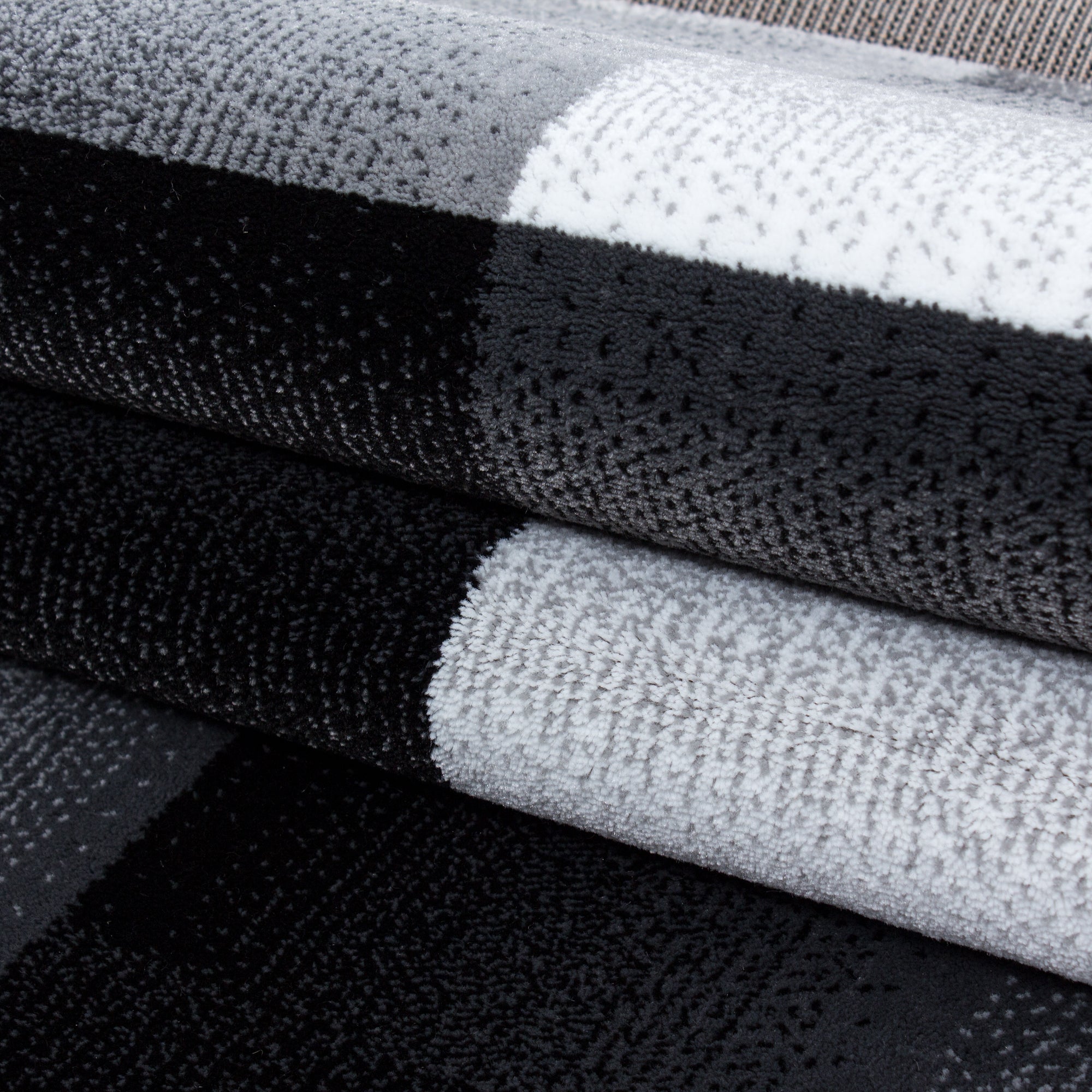 Modern short pile carpet for living room, abstract checkered design, black, easy to care for