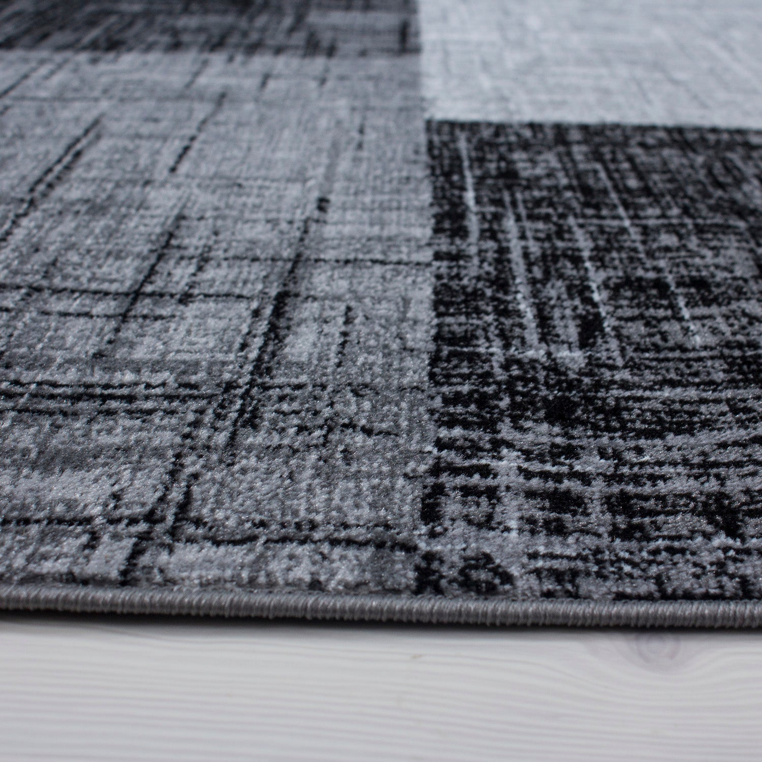 Tapis moderne à poils courts pour le salon, motif à carreaux abstrait, doux, facile d'entretien.